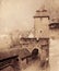 Cityscape of the medieval street with gates tower. Retro toned.