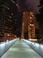 Cityscape night view on a bridge connecting public garden and shopping mall in Hong Kong