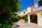 Cityscape with palm tree and residential house complex Porto Cervo