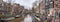 Cityscape, panorama - view of city channel with boats, city of Amsterdam