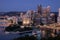 Cityscape of Pittsburgh and Evening Light. Fort Pitt Bridge. Blurry Ferry Cruise in Background Because of Long Exposure. Selective