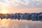 Cityscape at Pushkar, Rajasthan, India. Temples, buildings and ghats reflecting on the holy water of the lake at sunset.