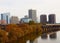 Cityscape, River Reflection, and Train in Autumn