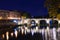 Cityscape romantic night view of Roma. Panorama with Tiber bridge. Famous tourist destination. Travel illuminated landscape in