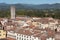 Cityscape with rooftops of Lucca town from Torre Ginigi tower. Tuscany central Italy