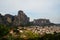 Cityscape scenic view of Kalambaka ancient town with beautiful rock formation mountain, immense natural boulders pillars and sky