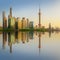 Cityscape of Shanghai and Huangpu River on sunset, beautiful reflection on skyscrapers, China