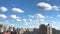 Cityscape skyline view of residential multi-storey buildings and summer cumulus clouds, time lapse accelerated video recording