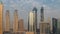 Cityscape with skyscrapers of Dubai Business Bay and water canal aerial morning timelapse.