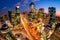 Cityscape of South Korea. Night traffic speeds through an intersection in the Gangnam district of Seoul, Korea.