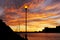 Cityscape and street lights against beautiful golden sunset