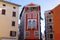 cityscape street view in Rovinj Croatia with yellow and red houses doors and shutters