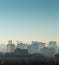 Cityscape at sunrise, building rooftops, bird view