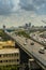 Cityscape and transportation with expressway and traffic in daytime from skyscraper of Bangkok.