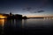 Cityscape of Valletta, Malta during the sunset and early dusk with dark blue sky and silhouette of the city reflected