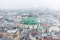 Cityscape of Vienna with Peterkirche St. Peter`s church in a snowy day, in the old town of Vienna, Austria.  View at the tower