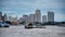 Cityscape view of Bangkok with boats on the Chao Phraya River and with the Asiatique Sky Ferris wheel of the Asiatique The