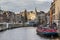 Cityscape - view of Bloemenmarkt flower market floating on barges, the Singel canal, city of Amsterdam