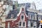 Cityscape - view on the old houses of Amsterdam in the rain through motorcycle windshield