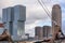 Cityscape - view of the skyscrapers of district Feijenoord through the rigging of the moored sailboat, Rotterdam