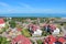 Cityscape of Wladyslawowo town from above with streets houses cars and sea