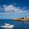 Ciutadella Sa Farola Lighthouse with yatch boat