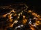 Civetta city night drone view. Fireworks in new year in dolomites . Aerial view of the city at night. Long exposure photo.