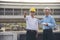 Civil Construction engineer teams shaking hands together wear work helmets worker on construction site. Foreman industry project