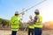 Civil engineer inspects work using radio communication with the management team in the construction area