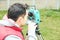 Civil engineer land survey with tacheometer or theodolite equipment. Worker Checking construction site on the road