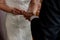 Civil wedding bride and groom holding hands wedding rings bands exchange