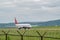 Civilian passenger plane with turbojet engines accelerates along the runway on the airport field