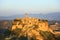 Civita di Bagnoregio landmark, aerial panoramic view on sunset. Italy