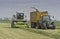 Claas chopper filling Veenhuis silage wagon