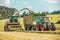 Claas Jaguar 930 harvester and a Fendt 926 with a Krone ZX400GL trailer works on a field