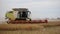 Claas Lexion 760 combine harvester in a yellow field in Echuca, Victoria, Australia