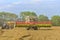 Claas Lexion 7600 with Case IH tractor