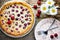 Clafoutis cherry pie on rustic background