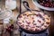 Clafoutis cherry pie on wooden background