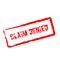 Claim Denied red rubber stamp isolated on white.