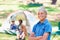 Claiming his camping spot. A boy standing in front of his campsite.