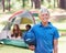 Claiming his camping spot. A boy standing in front of his campsite.