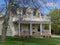 Clapboard siding house with double-decker porch