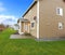 Clapboard siding house with a green lawn