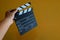 A clapperboard, device used in filmmaking and video production