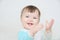 Clapping hands cute smiling baby, caucasian blue eyes cheerful infant playing