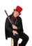 A clarinet player with a red hat and black outfit