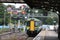 Class 172 dmu train and old Great Western Signal Gantry