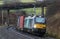 Class 88 electric hauling container train on WCML