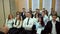 A class on a university listening a teacher. Group of students in a classroom, listening as their teacher holds a